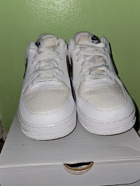 Nike White Low-Top Sneakers with Black Swoosh